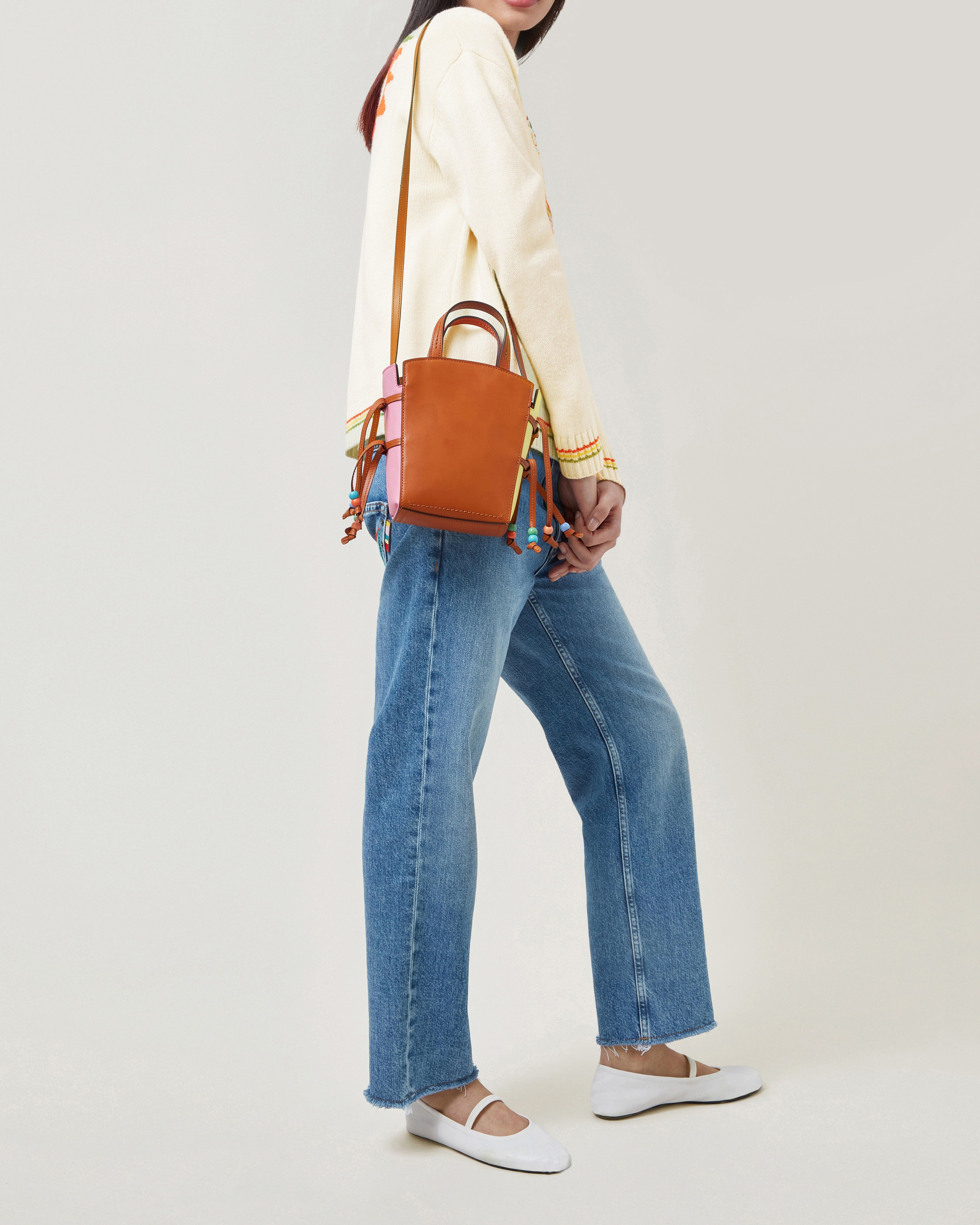 Model wearing Mulberry x Mira Mikati Mini Clovelly tote in Oak