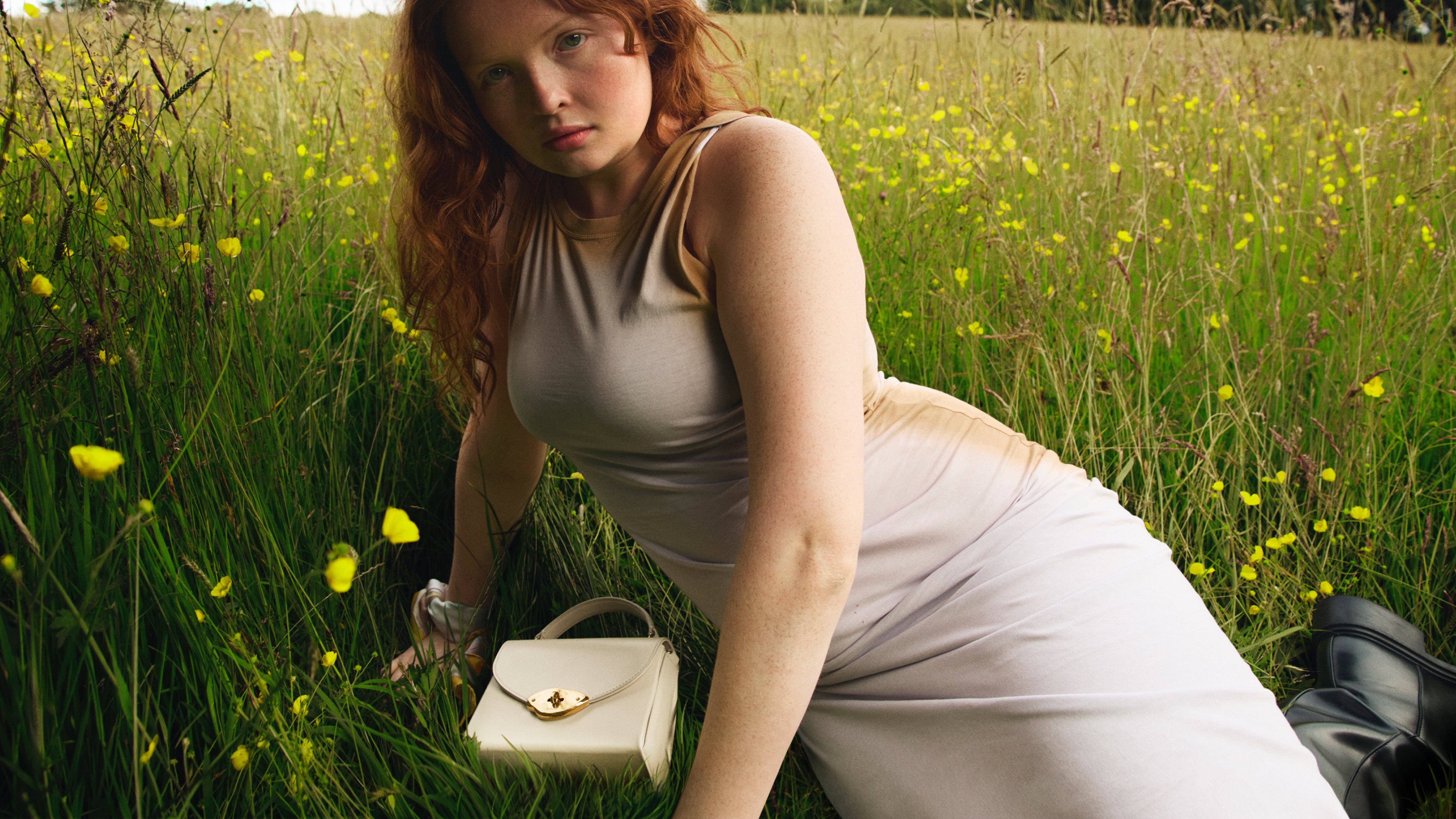 Model wearing Lana Top Handle bag in Eggshell