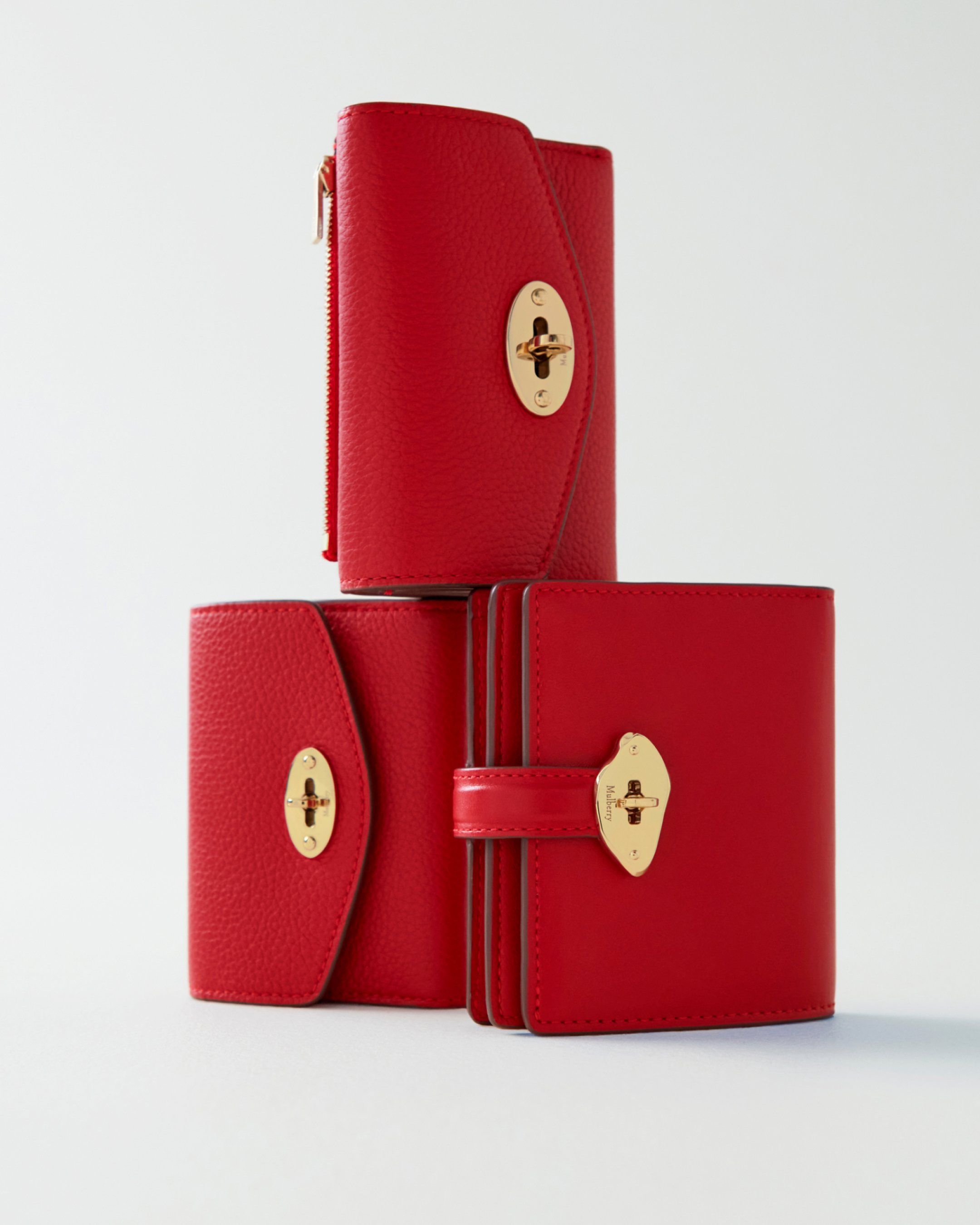 Three Mulberry wallets in scarlet red leather