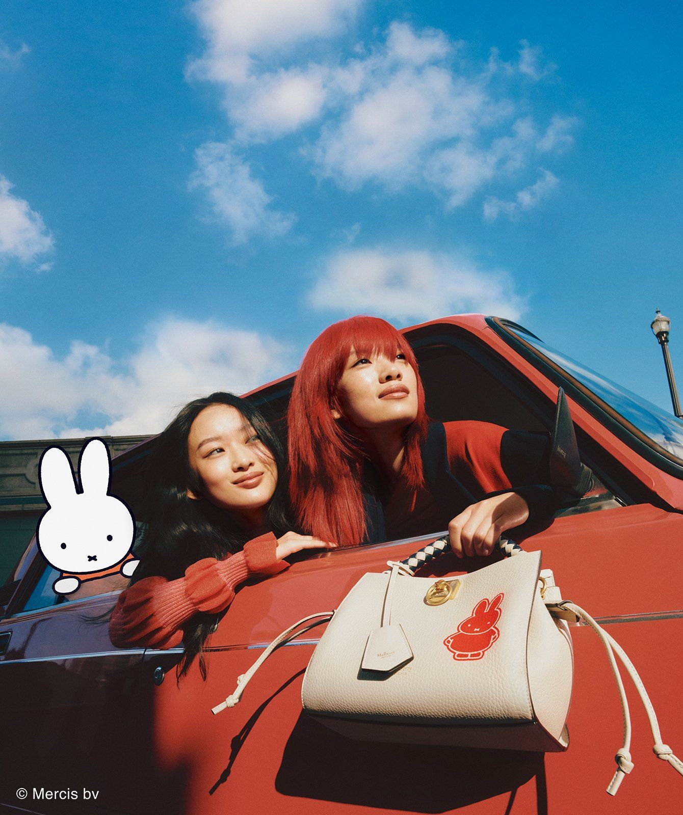 Two models with a small Iris bag from Mulberry with a red Miffy print