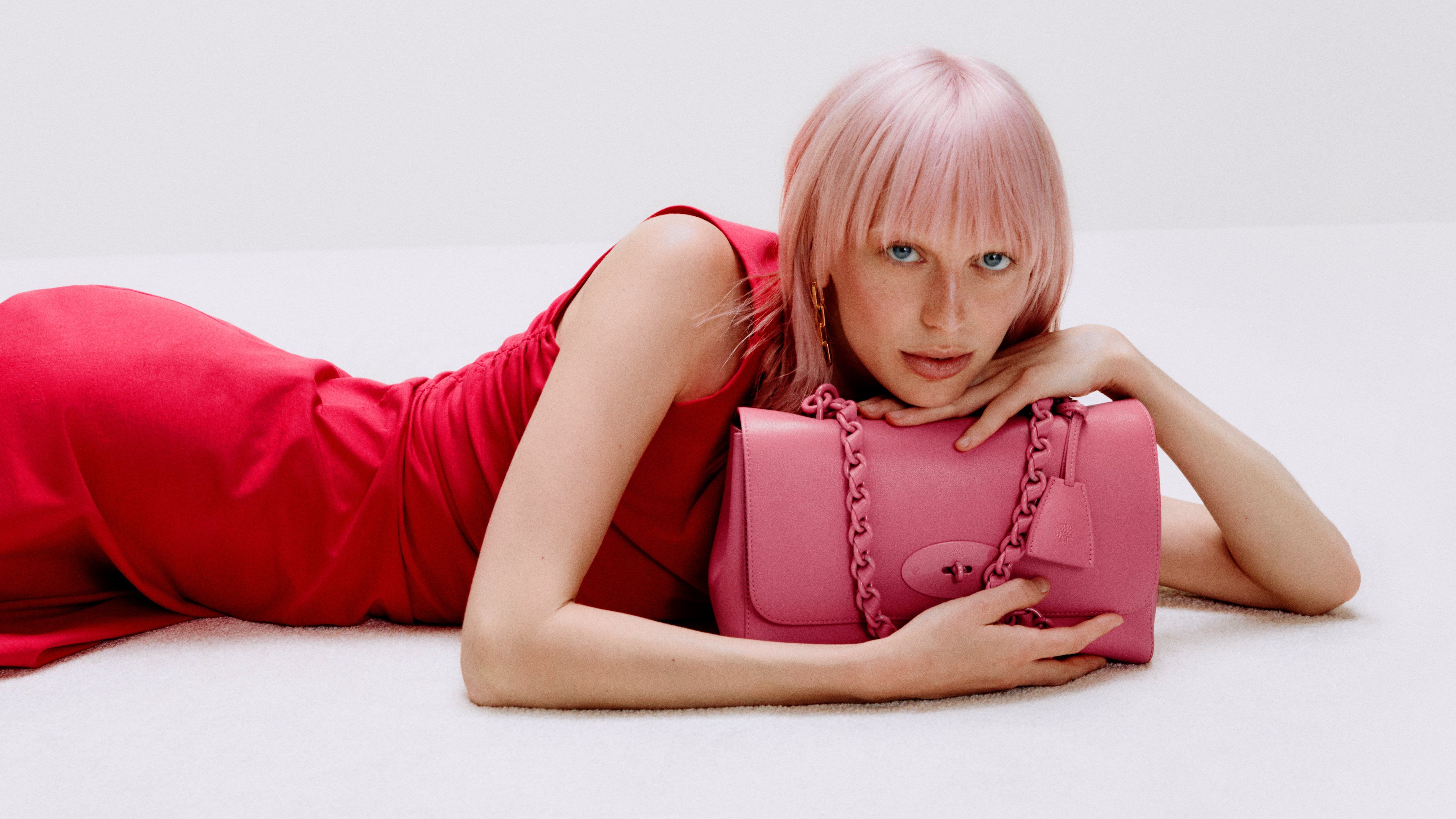 model wearing mulberry medium lily bag in geranium pink