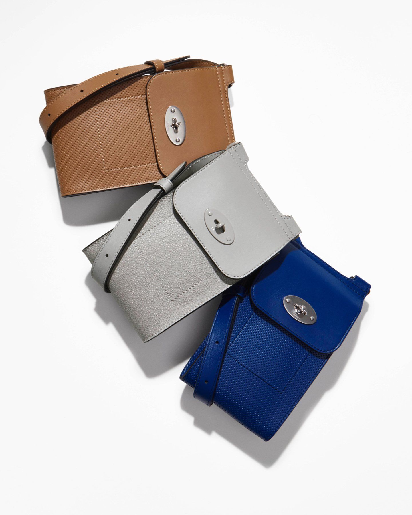 trio of mulberry mini antony bags in teak, pale grey and pigment blue