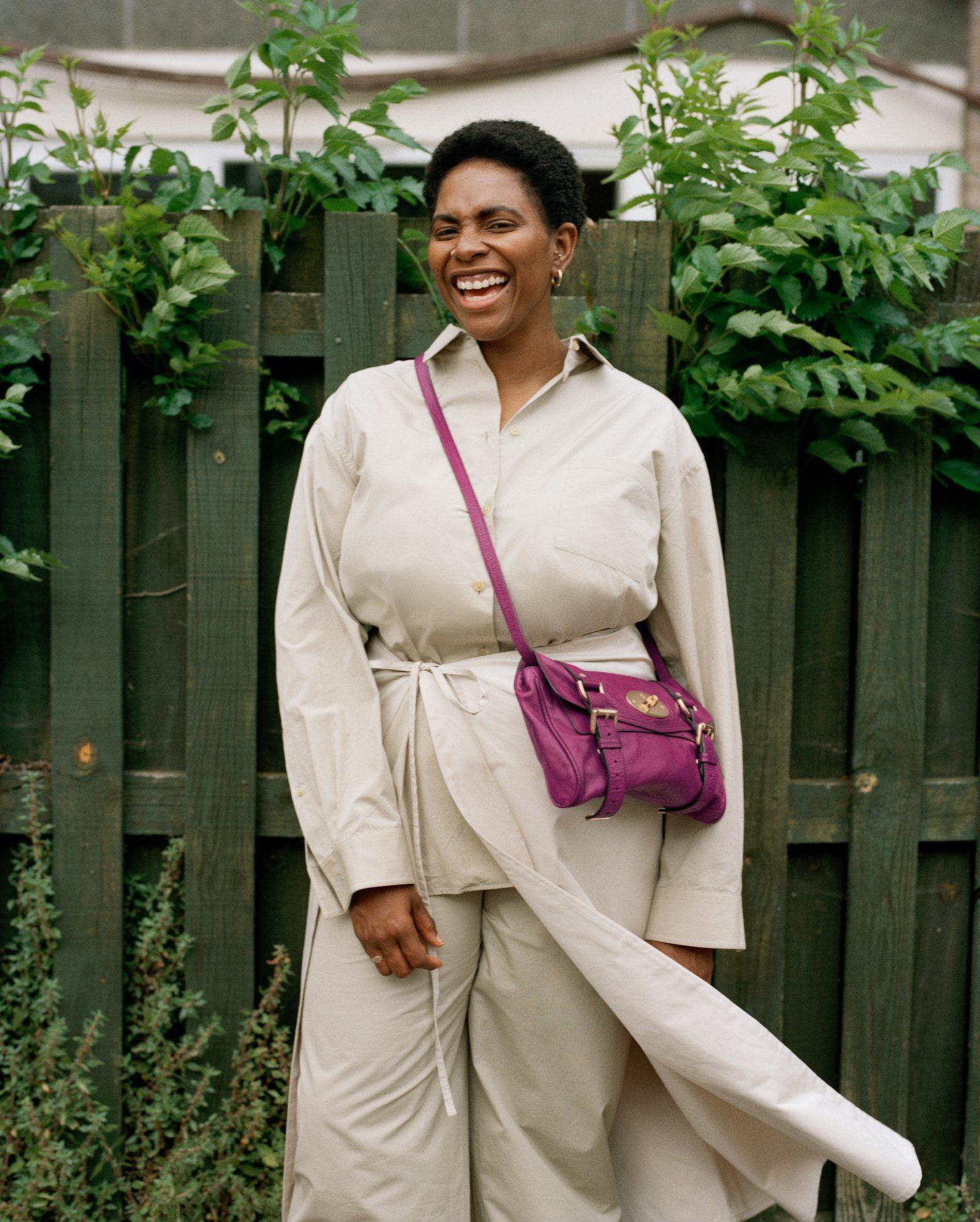 Woman in a beige outfit wearing a pink Mulberry Alexa bag