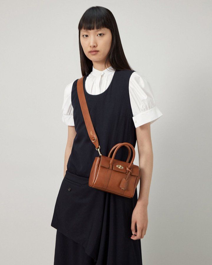 Model wearing the Mini Bayswater bag in Oak Natural Vegetable Tanned leather