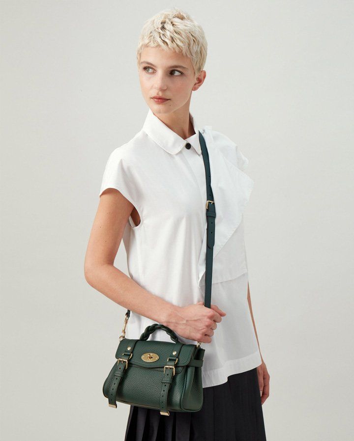 Model wearing the Mini Alexa bag in Mulberry Green Leather
