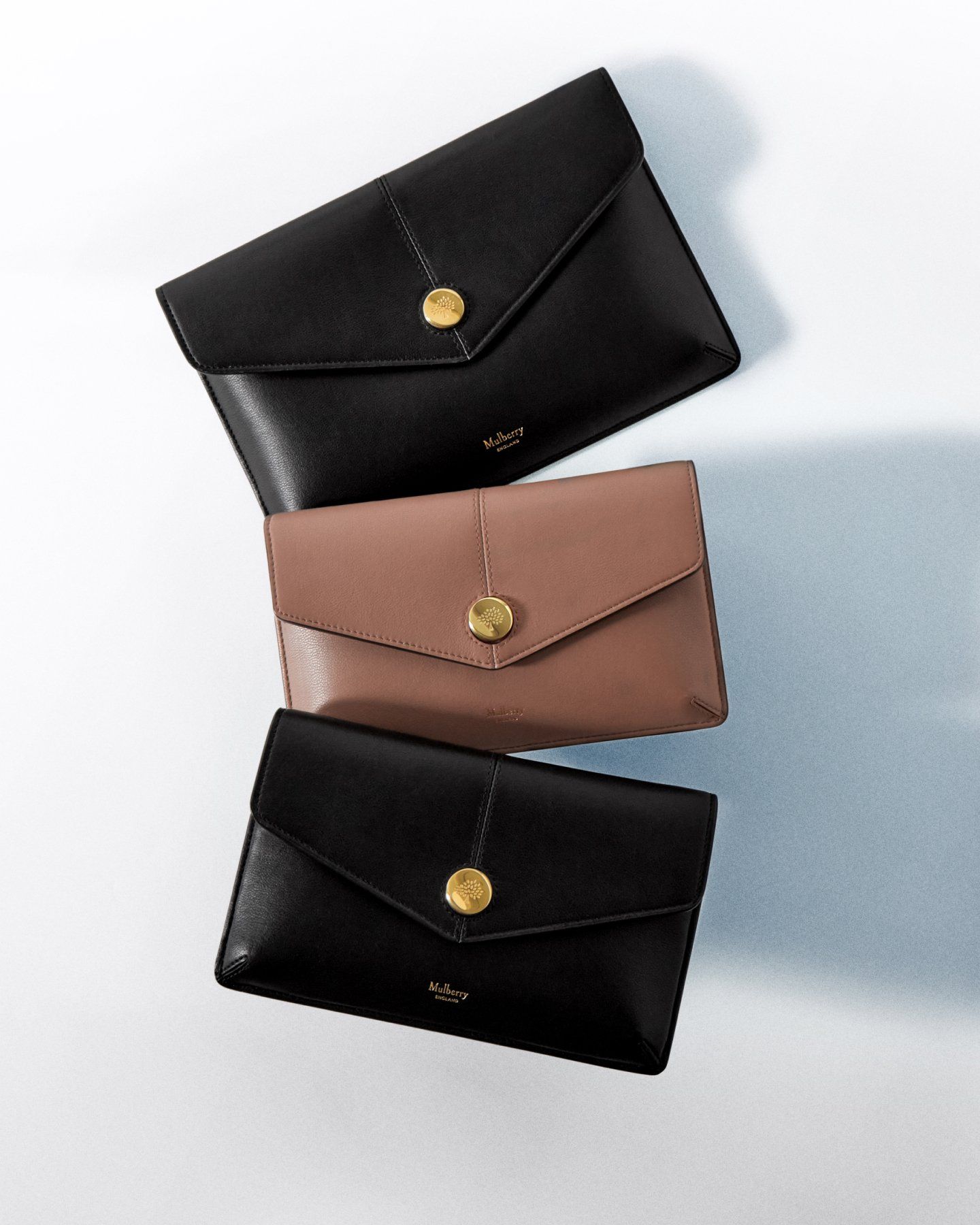 Three Mulberry Press Stud wallets in leather