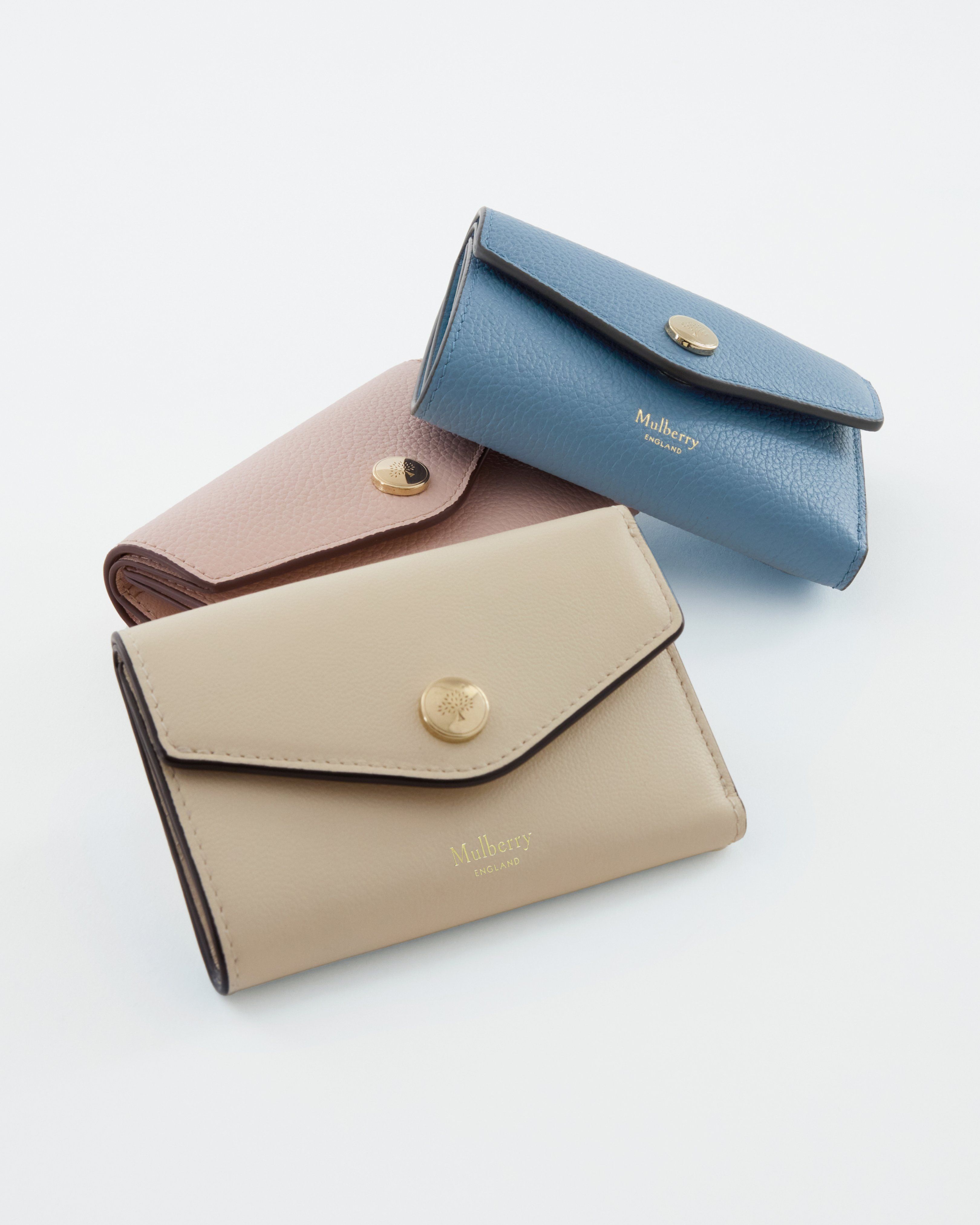 Trio of Mulberry press stud wallets in brighton blue, chalk and blossom pink