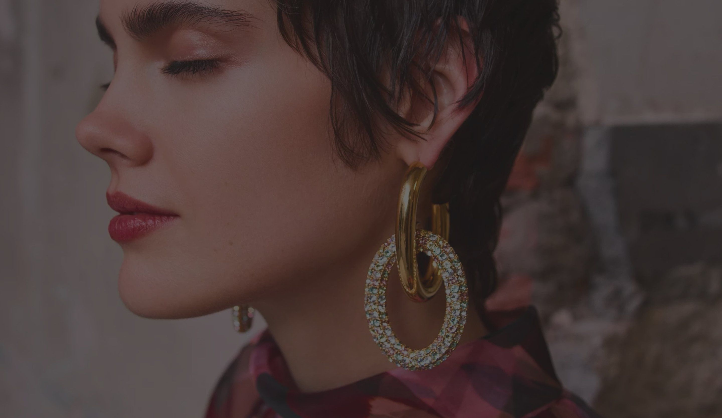 model wearing mulberry gold large hoop earrings