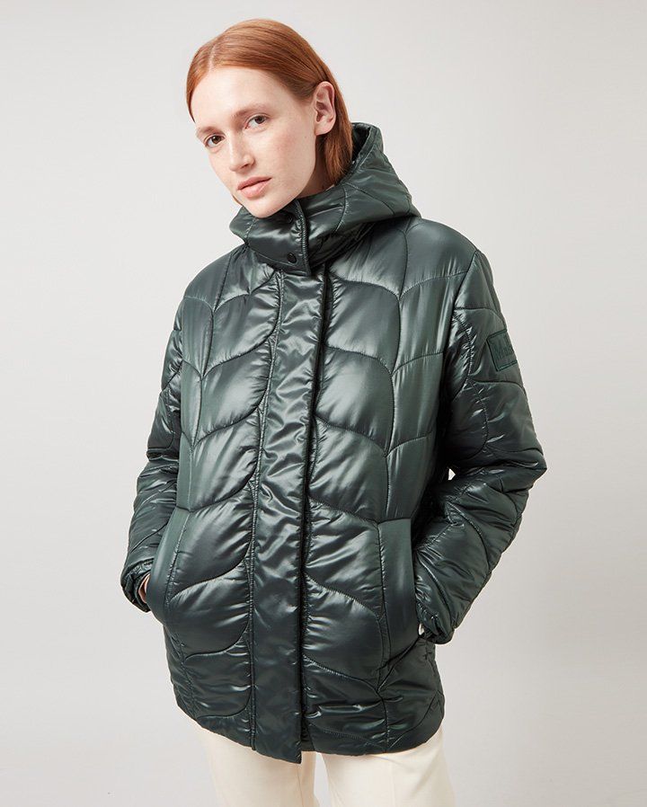 Model wearing the Softie Quilted Hooded Puffer Jacket in Mulberry Green Recycled Nylon