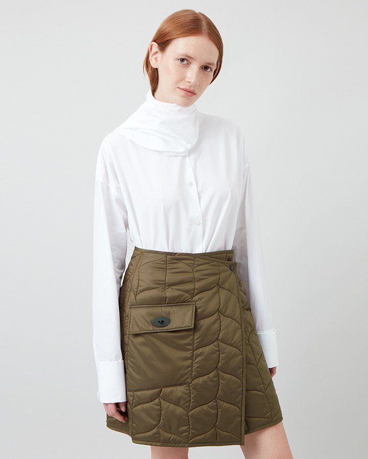 Model wearing the Softie Quilted Wrap Skirt in Khaki Recycled Nylon