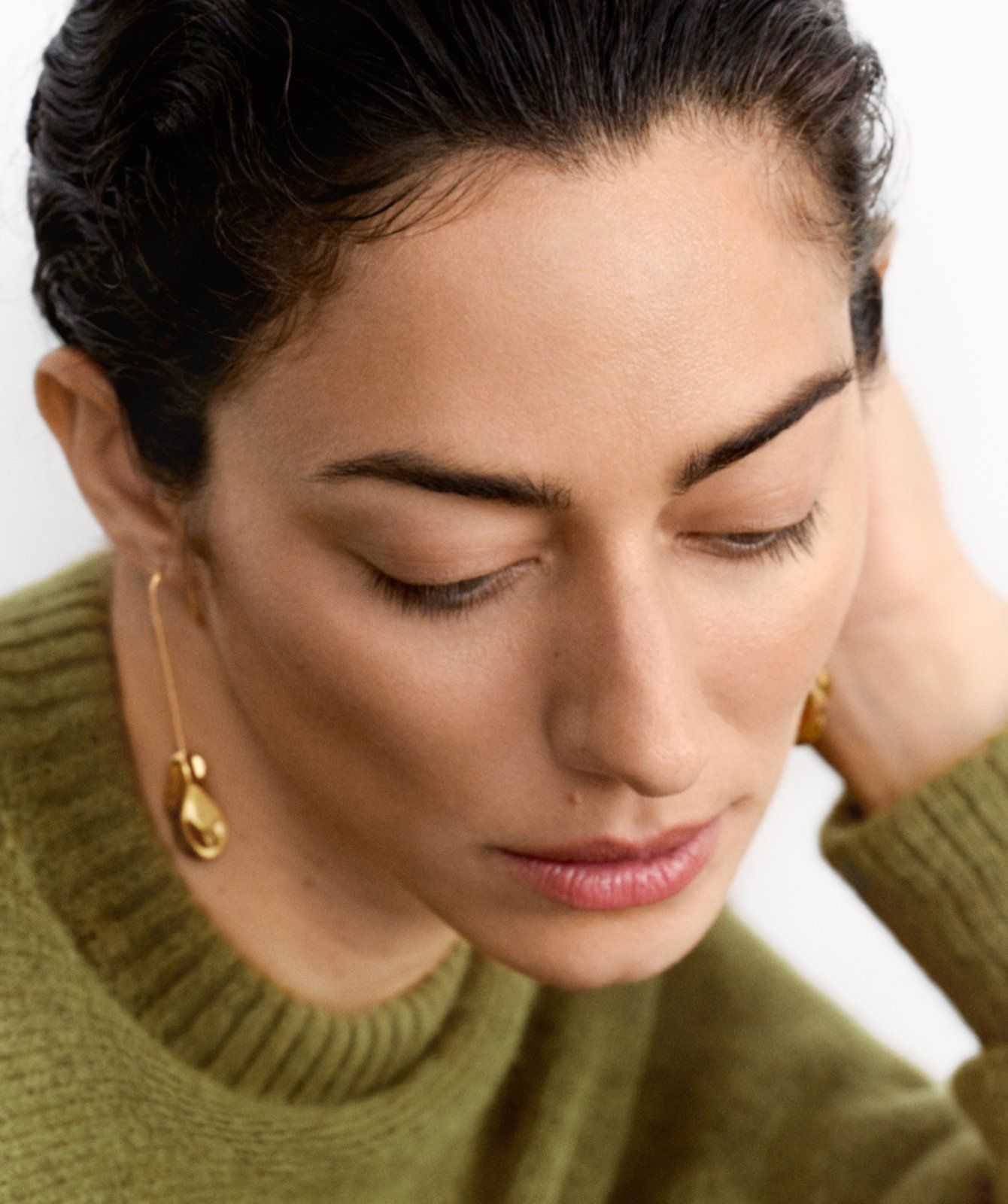 Model wearing the Mulberry x Rejina Pyo Textured Hook Earring in Gold Plated Brass