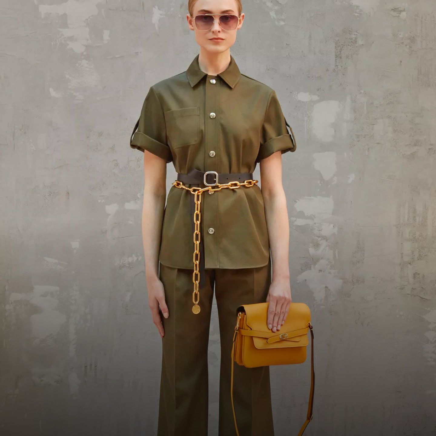 model wearing mulberry belted bag in deep amber