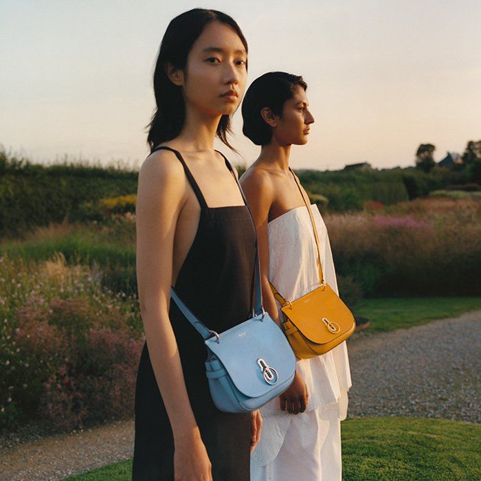 models wearing mulberry amberley satchel bags in blue and yellow