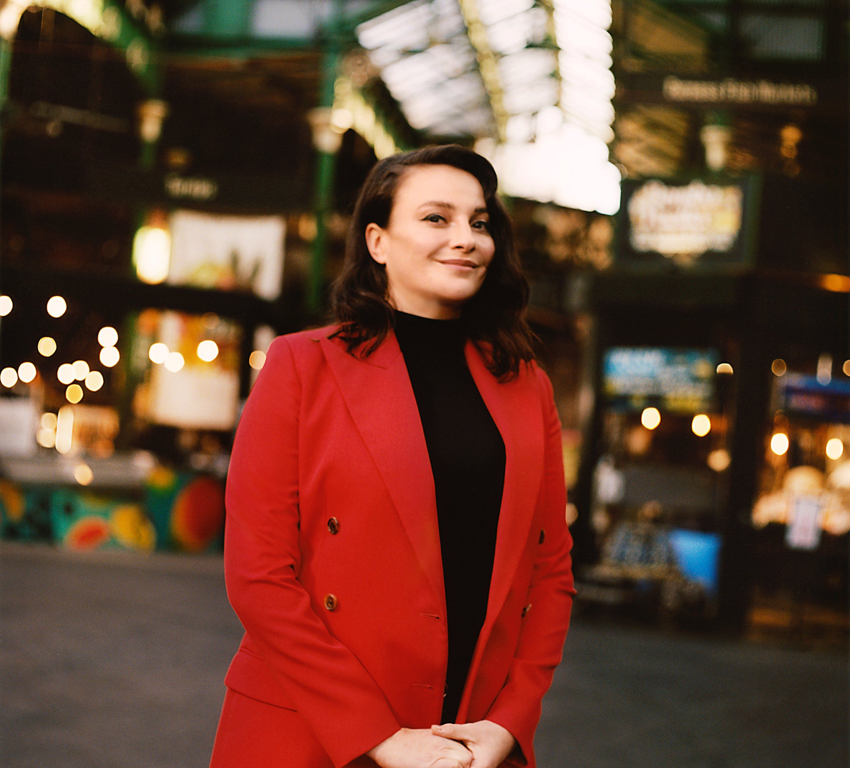 portrait of Gizzi Erskine a restauranteur in a market