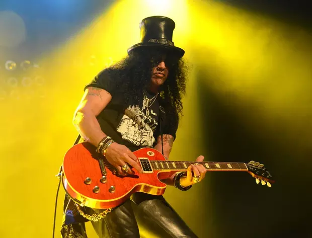 GRAMMY Award Winning Rockstar, SLASH, Signs Guitar At Hard Rock