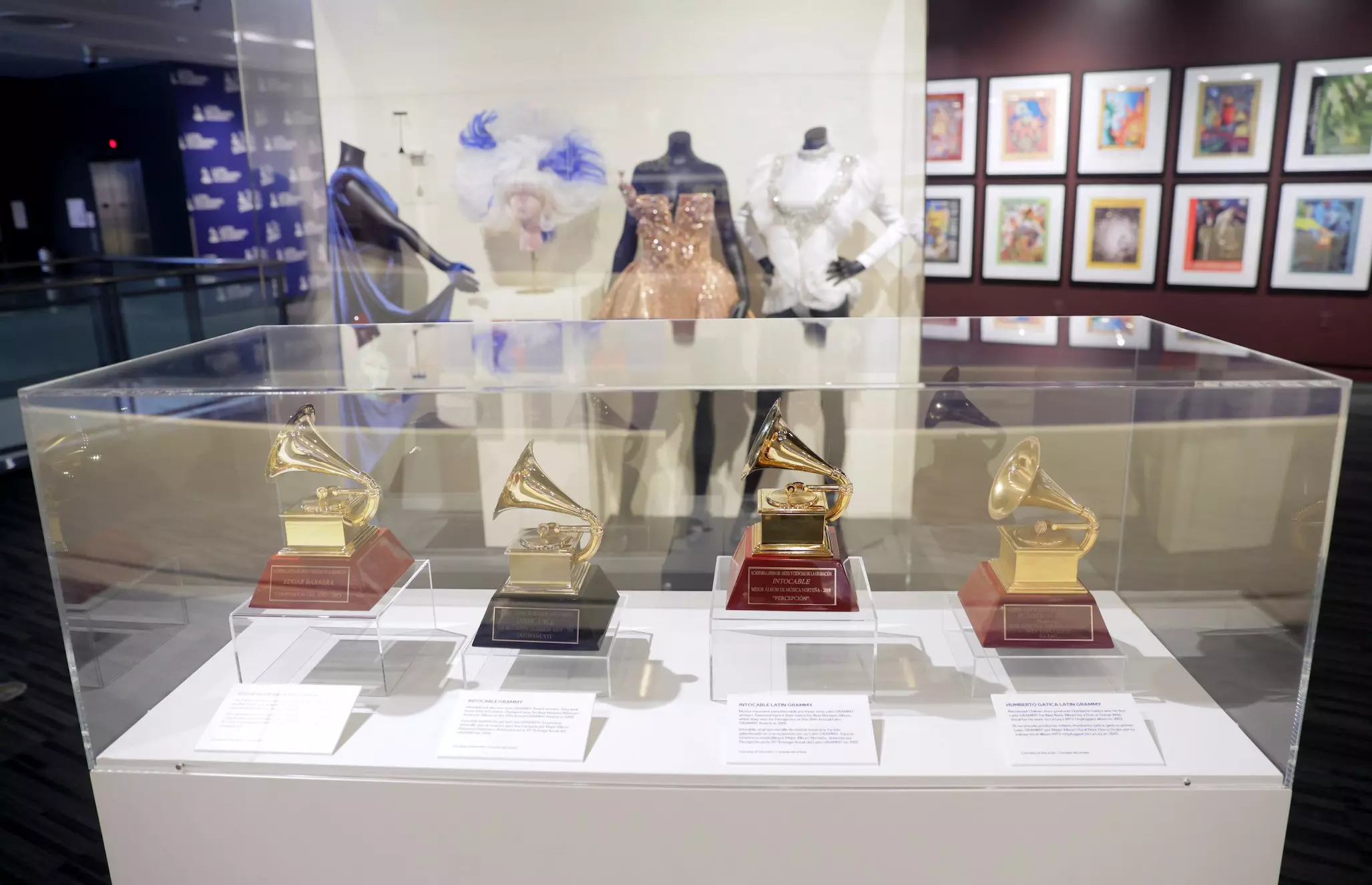 Inside The Latin GRAMMYs Exhibit At The GRAMMY Museum: Karol G’s History-Making Moments, Rosalia’s Iconic First Red Carpet Look & More