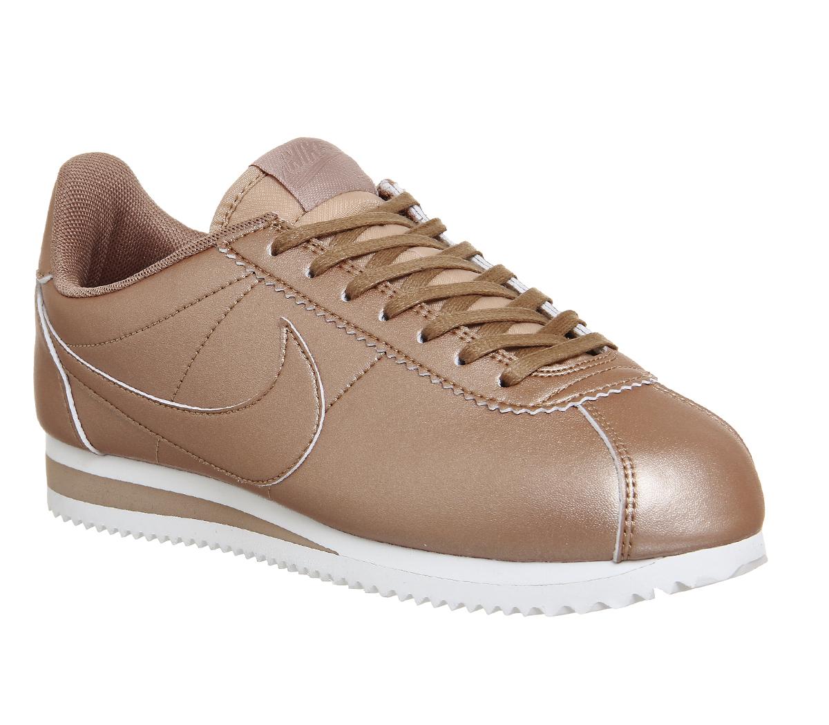 Nike trainers with on sale rose gold tick