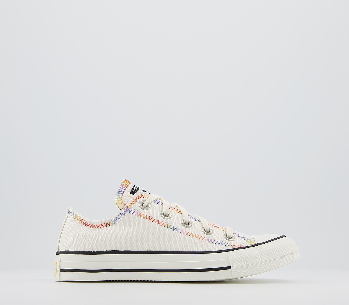 white converse with rainbow stitching