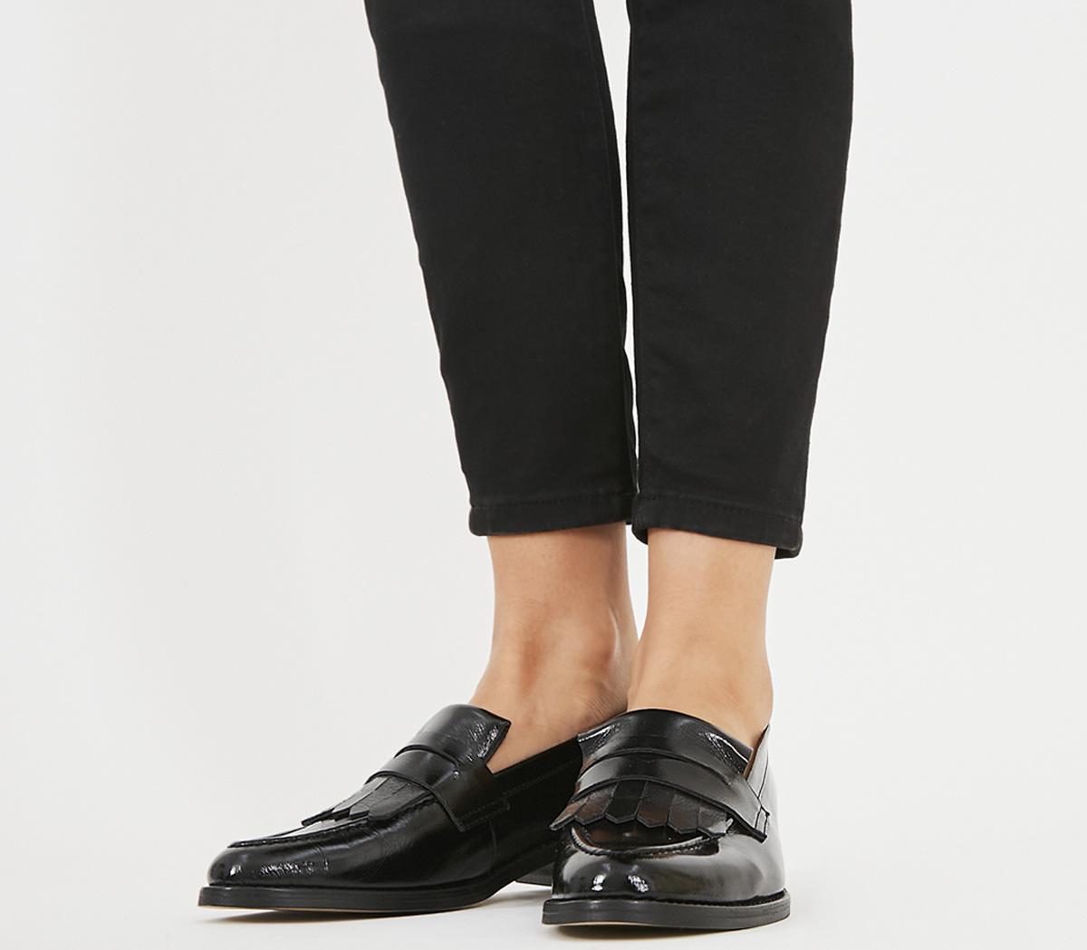 Black store fringe loafers