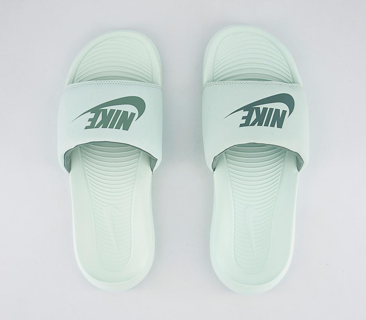 mint green nike sliders