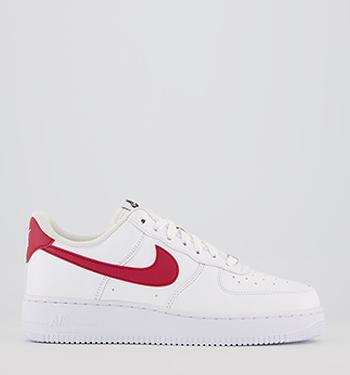 white nike trainers with red tick