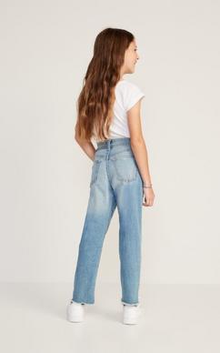 Yound sexy lady in crop top and mom jeans isolated on the white
