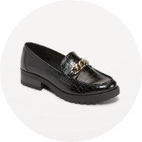 A pair of black dressy slip on shoes.