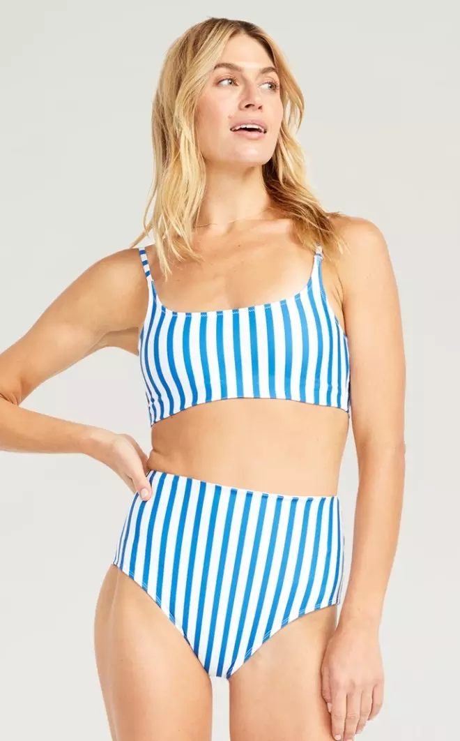 A female model wears a striped scoop neck bikini top and matching hight waist bikini bottom.