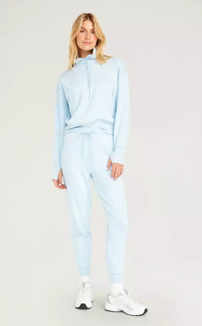 A female model wears Mid-Rise Cloud 94 Soft Ankle Jogger Pants