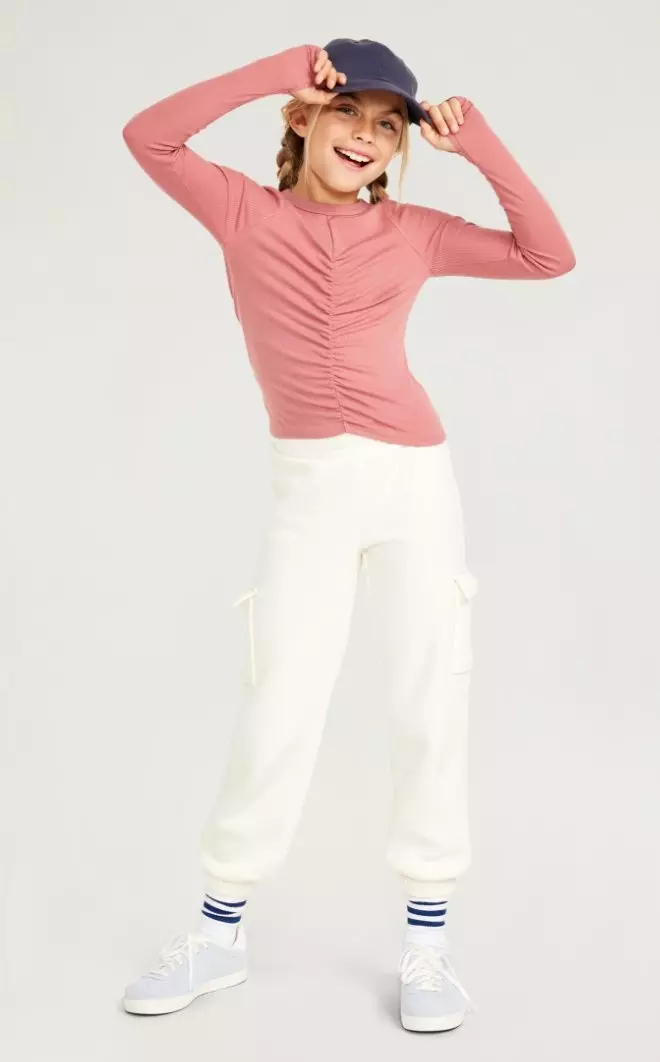 A female model wears an UltraLite Long-Sleeve Ruched Performance Top