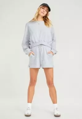 A cozy grey fleece sweatshirt and shorts set.