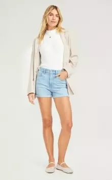 A woman in a pair of Wow jean shorts.
