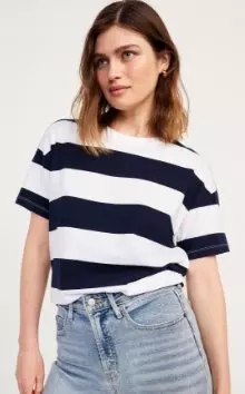 A female model wearing a striped crew-neck T-shirt.