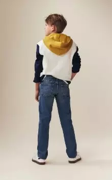 A model wearing built-in flex skinny jeans.
