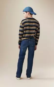 A young model dressed in wow straight non stretch jeans.