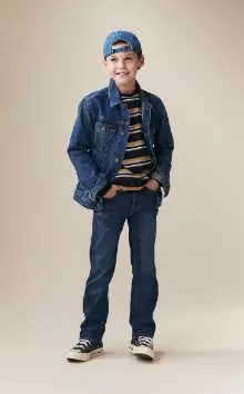 A young model dressed in wow straight non stretch jeans.