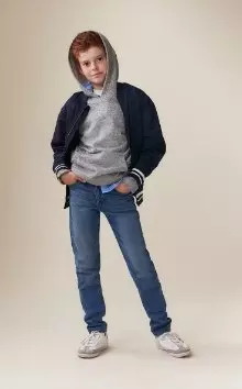 A model wearing original taper built-in flex jeans