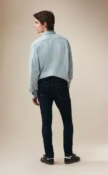 A male model wearing skinny jeans.