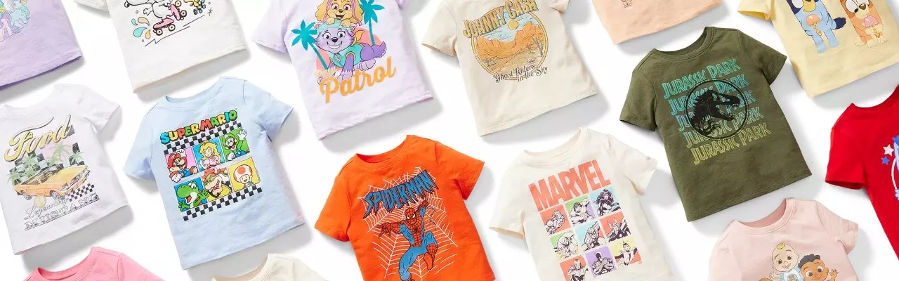 Image features laydown of graphic t-shirts for toddler boys.