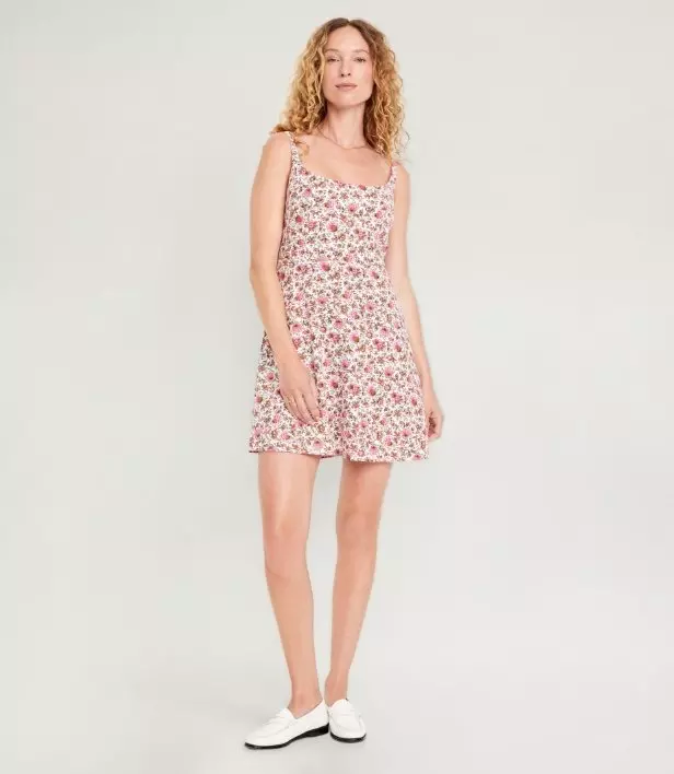 A floral print mini dress with spaghetti straps.