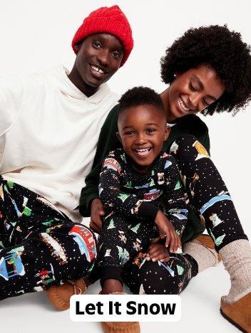 A family in matching reindeer print pjs.