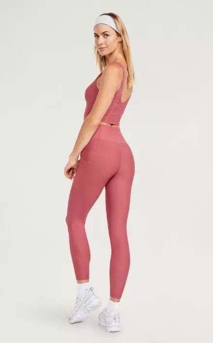 A female model wears High-Waisted PowerSoft Leggings.