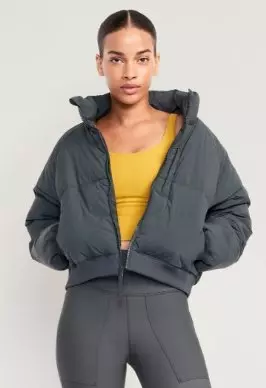 A female model wears a cargo-style activewear jacket