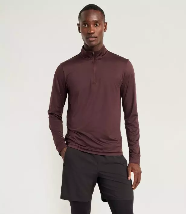 A male model wears CloudMotion quarter zip.