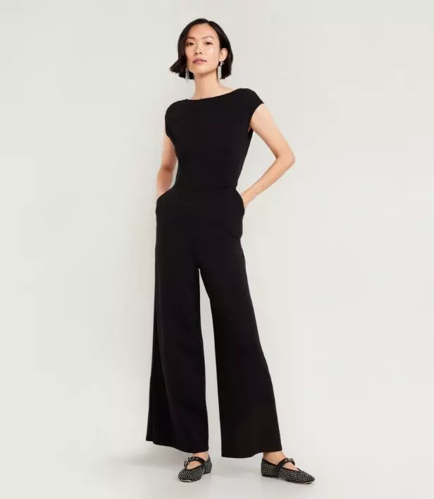 Image of a model wearing black ponte knit jumpsuit.