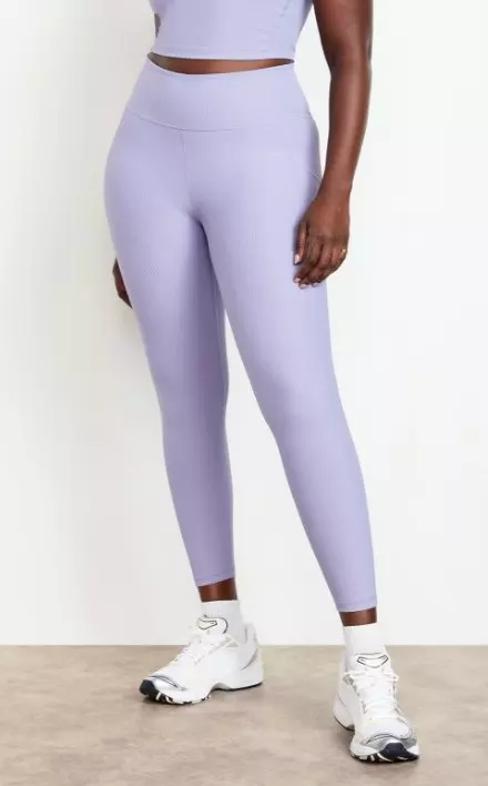 A female model wears High-Waisted PowerSoft Leggings.