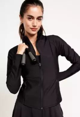 A female model wears a PowerSoft Rib Full Zip jacket.