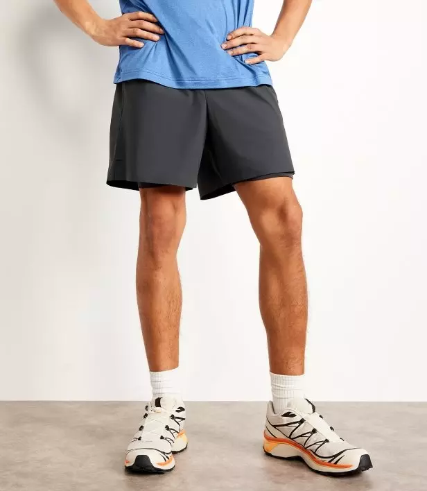 A male model wears active shorts.