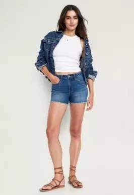 A woman in denim shorts.