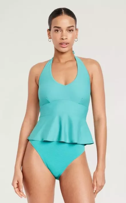 A female model wears a Matte Tankini Swim Top.